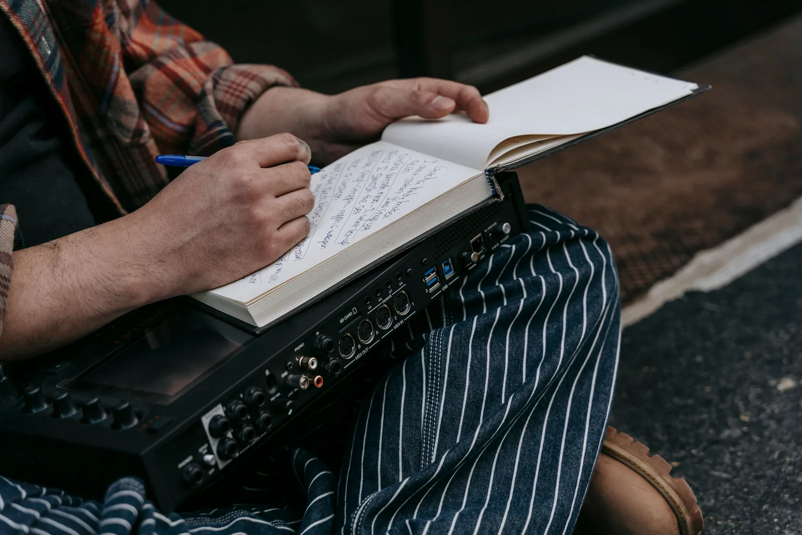 Notebook, pen and written notes during a storytelling session